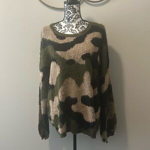 NWOT.  Woman’s long sleeve eyelash sweater with round neckline & predator print.